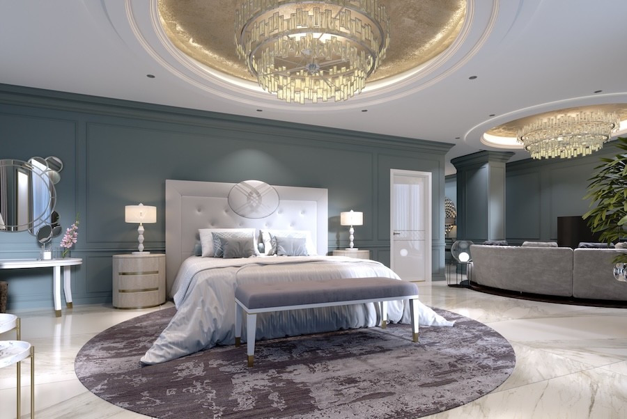 An elegant bedroom layers lighting using lamps and chandeliers.