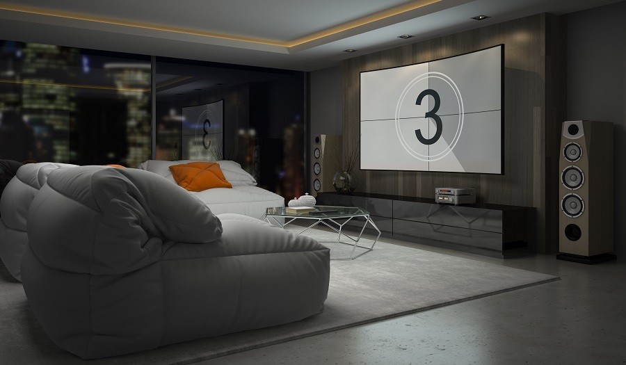 Sophisticated home theater with comfortable couches and a film leader countdown on the screen. 